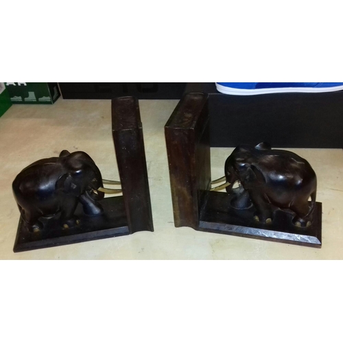 35 - Pair of hard wood carved elephant book ends, each with secret compartment