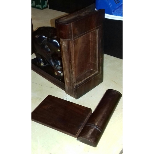 35 - Pair of hard wood carved elephant book ends, each with secret compartment