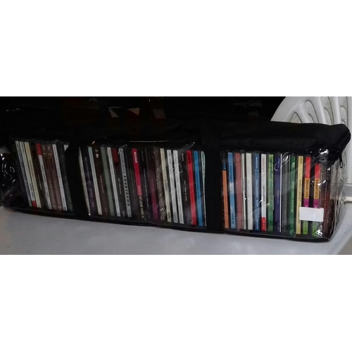 58 - Quantity of cds in cloth carry case