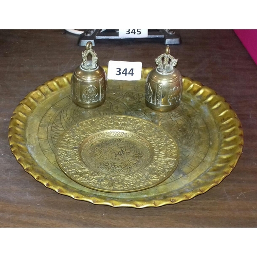 344 - 28cm diameter engraved brass trey, pair of Indian ceremonial bells and other heavy brass pin dish