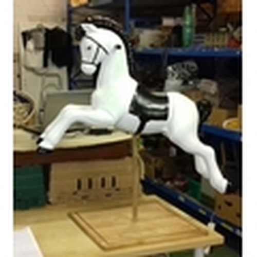 422 - Refurbished plastic 1960's spring horse on bespoke wooden display plinth, overall height 104 cm tall