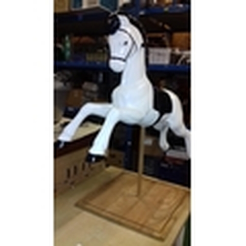 422 - Refurbished plastic 1960's spring horse on bespoke wooden display plinth, overall height 104 cm tall