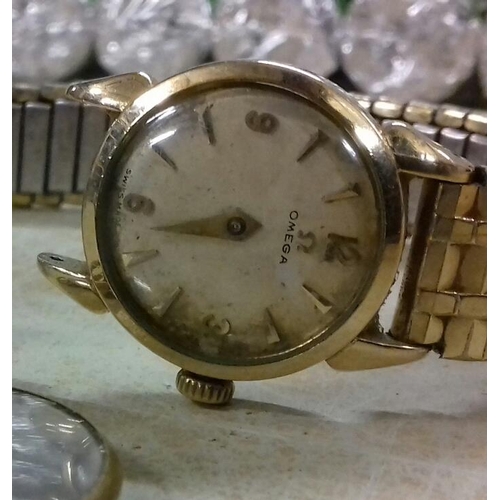 584 - Old ladies Omega watch (minute hand missing) with Spiedel USA elasticated strap & yellow metal mourn... 