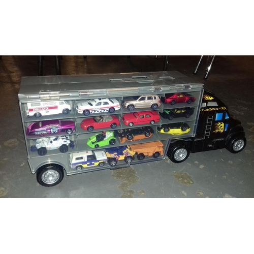 245 - Toy car transporter with carry handle and full of assorted toy cars