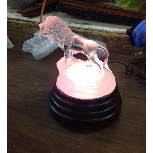 65 - Frosted glass dolphin and clear glass lion ornaments with multicolour light up display stand