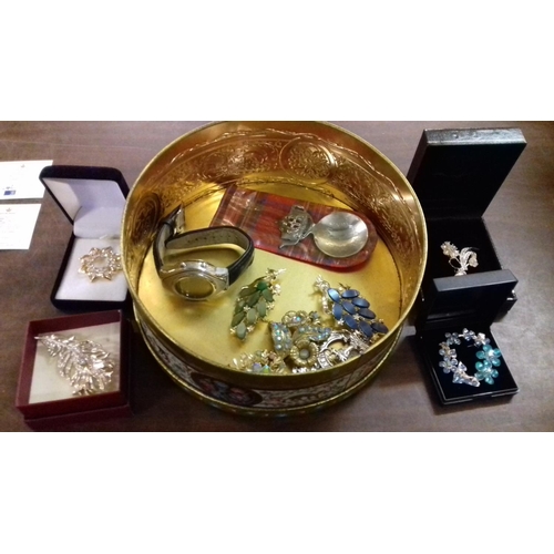 394 - Old tin with assorted brooches, cobalt speechmaster watch etc.