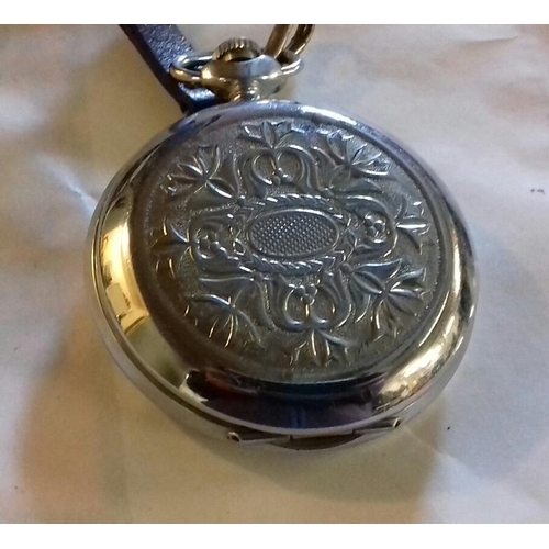 32 - Sekonda 18 jewel pocket watch in embossed white metal case, working order