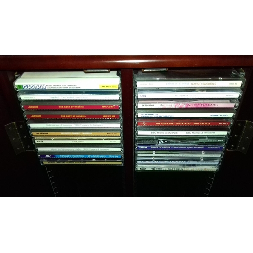 583 - 33 x 17 x 80 cm CD cabinet with assorted CDs