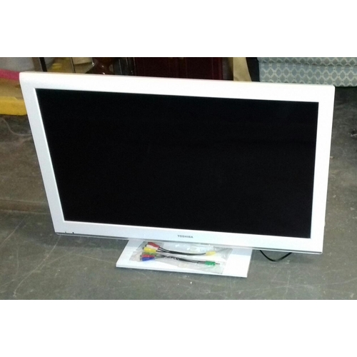 497 - White Toshiba 32-inch LCD TV with built-in DVD player, no remote but working order