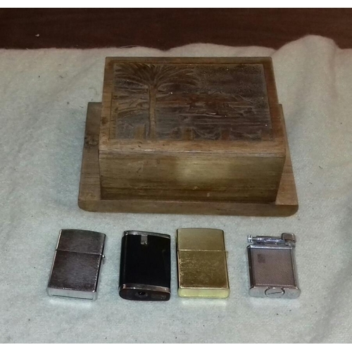 113 - Carved wooden cigarette box and 4 x lighters