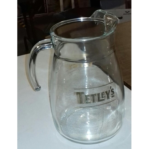 101 - 23cm tall glass Tetley's jug