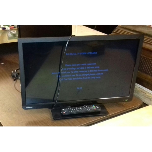 555 - Toshiba 24 inch LCD TV with built-in DVD player and remote, working order