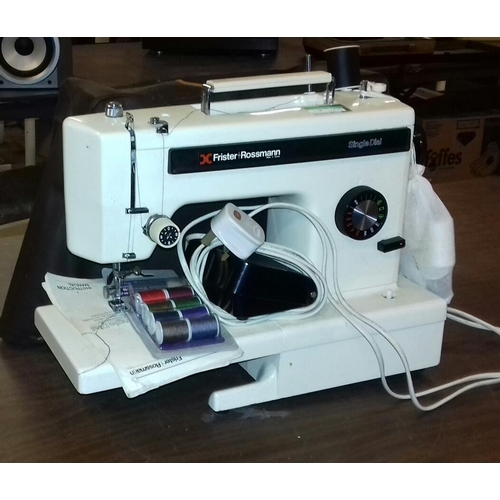 552 - Frister and Rossmann single dial electric sewing machine working with dust cover and manual