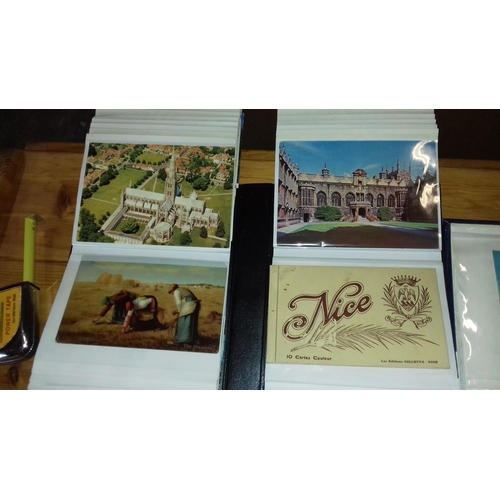 301 - 2 x photo albums with approximately 180 assorted postcards