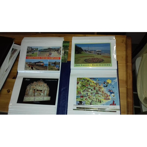 301 - 2 x photo albums with approximately 180 assorted postcards