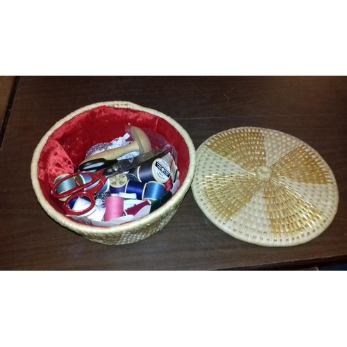 244 - Small round wicker sewing basket with contents