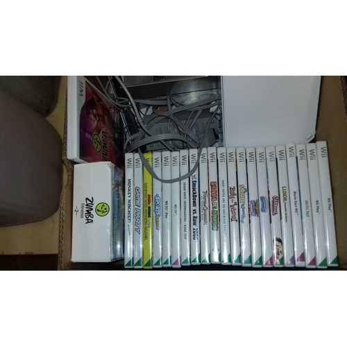 140 - Nintendo Wii games console with nun chucks, controllers, Wii Fit board, paddles, Zumba belt and 23 x... 