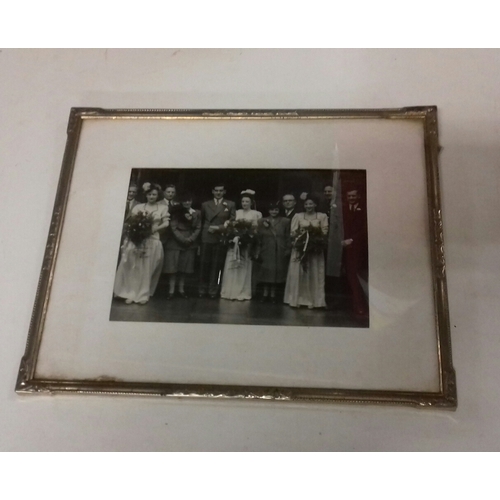 96 - Vintage silver coloured picture frame with black and white wedding photograph