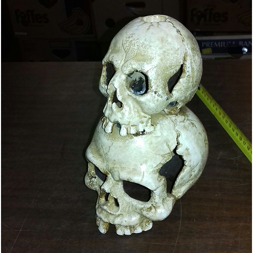 27 - 19 cm tall cast iron skulls