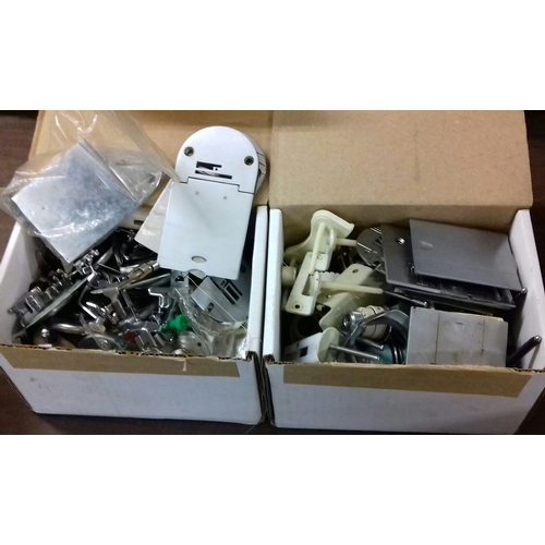 218 - 2 x boxes of assorted sewing machine accessories to include feet, covers etc.