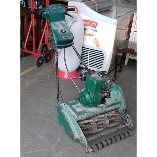 233 - Vintage Qualcast Suffolk Punch petrol lawnmower believed working but missing petrol cap and collecti... 