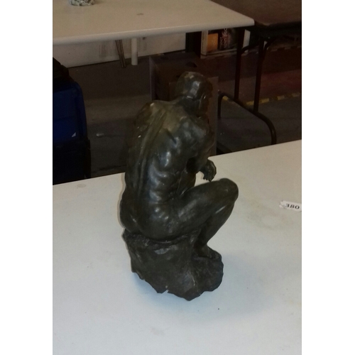 101 - 30 cm tall bronze look hollow composite 'The Thinker' statue with damage to left side on base