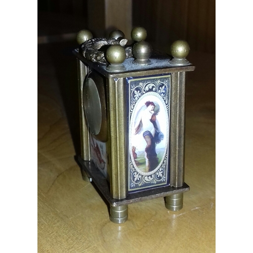 531 - 7 cm tall wind up brass erotica miniature clock with Omega face, working order