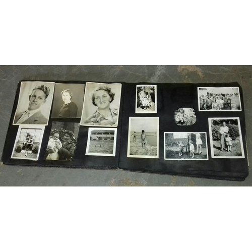 94 - Vintage photo album with assorted black and white family portrait and holiday photographs etc.