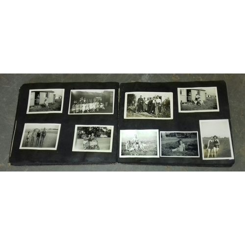 94 - Vintage photo album with assorted black and white family portrait and holiday photographs etc.