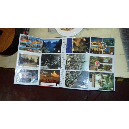 310 - Photograph album full of assorted colour souvenir postcards