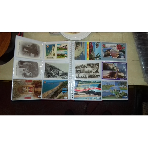 310 - Photograph album full of assorted colour souvenir postcards