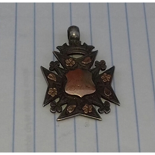 559 - Birmingham hallmarked silver Maltese cross pendant with gold shield front and detailing. Back engrav... 