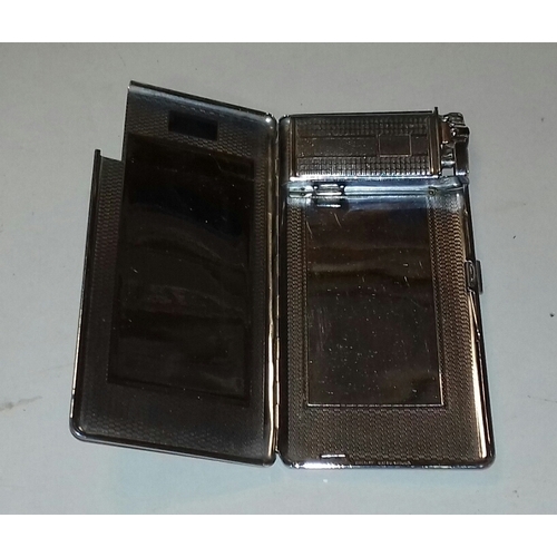 79 - Retro silver plated cigarette case with internal lighter