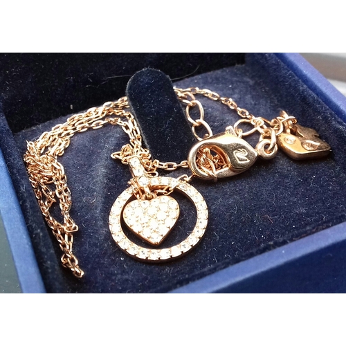 561 - Genuine Swarovski gold tone necklace with pendant in box