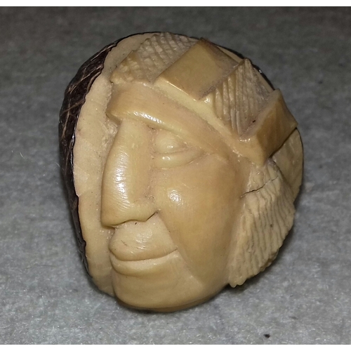 40 - Part carved nut approx' 5 cm tall depicting native american Red Indian face