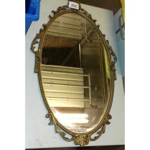 253 - 66 x 40 cm gilt metal framed Art Nouveau style wall mirror