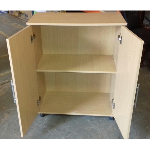 323 - 70 x 35 x 86 cm tall beech veneered 2 door cupboard on casters