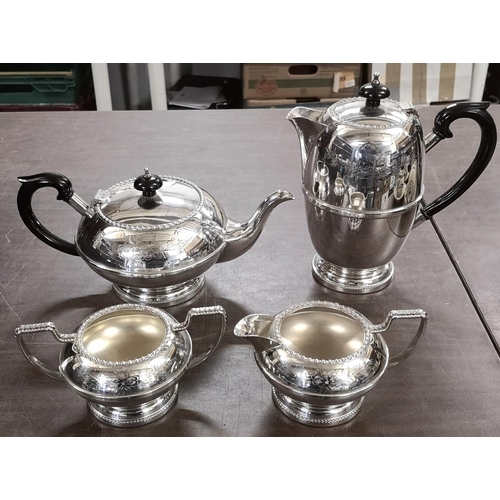 56 - 4 piece silver plated tea service with engraved decoration