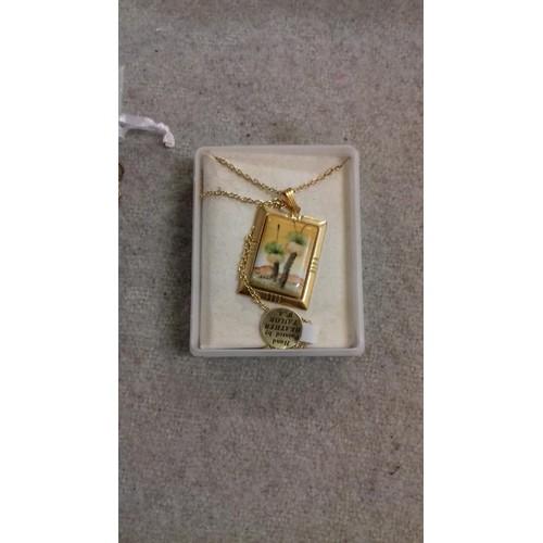515 - Heather Tailer W.A. hand painted porcelain pendant on gold tone mount with chain