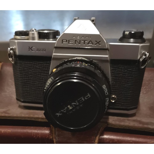 21 - Pentax Asahi K1000 35 mm SLR camera with 35/50/135 mm lenses, Sunpak auto 134 flash gun, tripod and ... 