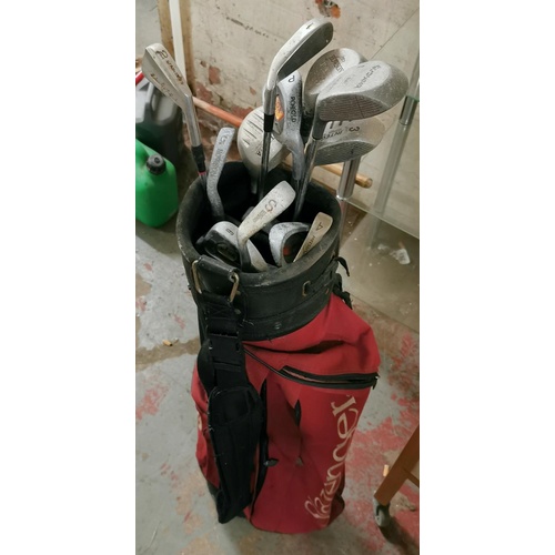 35 - Assorted childrens and adults practice golf clubs in Slazenger bag