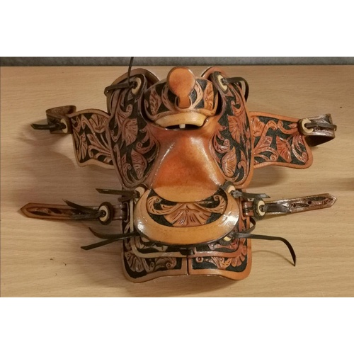 81 - Approx 14 cm long Spanish leather ornate patterned miniature saddle