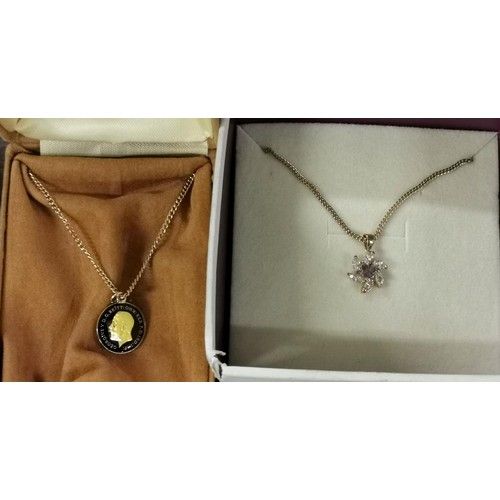 166 - 1935 painted 3d coin pendant on gold tone chain and other crystal pendant on gold tone chain