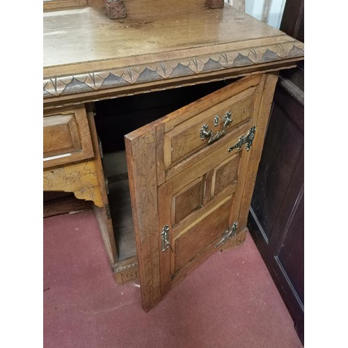 96 - 198 x 59 x 228 cm tall 19th century sideboard with intricate carving and illusion central double doo... 