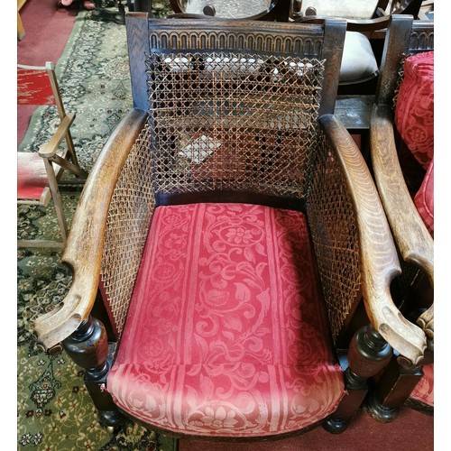 201 - Pair of ornate carved Bergere deep seated chairs - 1 needs repair to one side