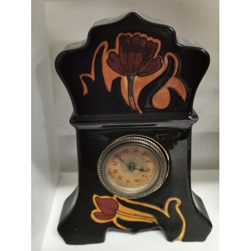 347 - 22 cm tall floral decorated ceramic mantle clock