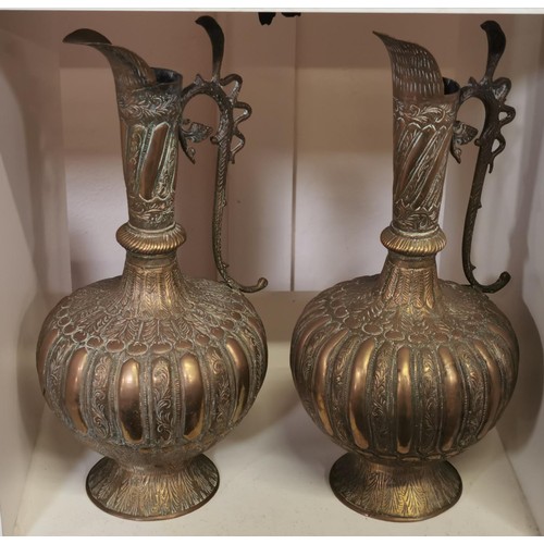 355 - Pair of 31.5 cm tall heavy brass ewers