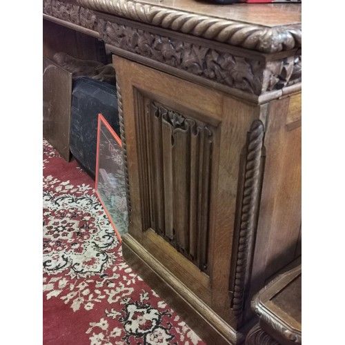 491 - 259 x 83 x 132 cm tall turn of the century oak linen fold buffet cabinet with carved back panel cent... 