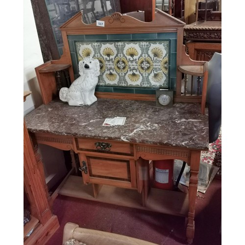 517 - 108 x 49 cm marble top wash stand with tiled splash back (marble top has full width crack)