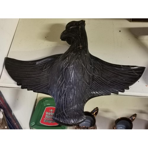 665 - 38 cm tall and 50 cm wide carved wooden bird with spread wings wall decoration